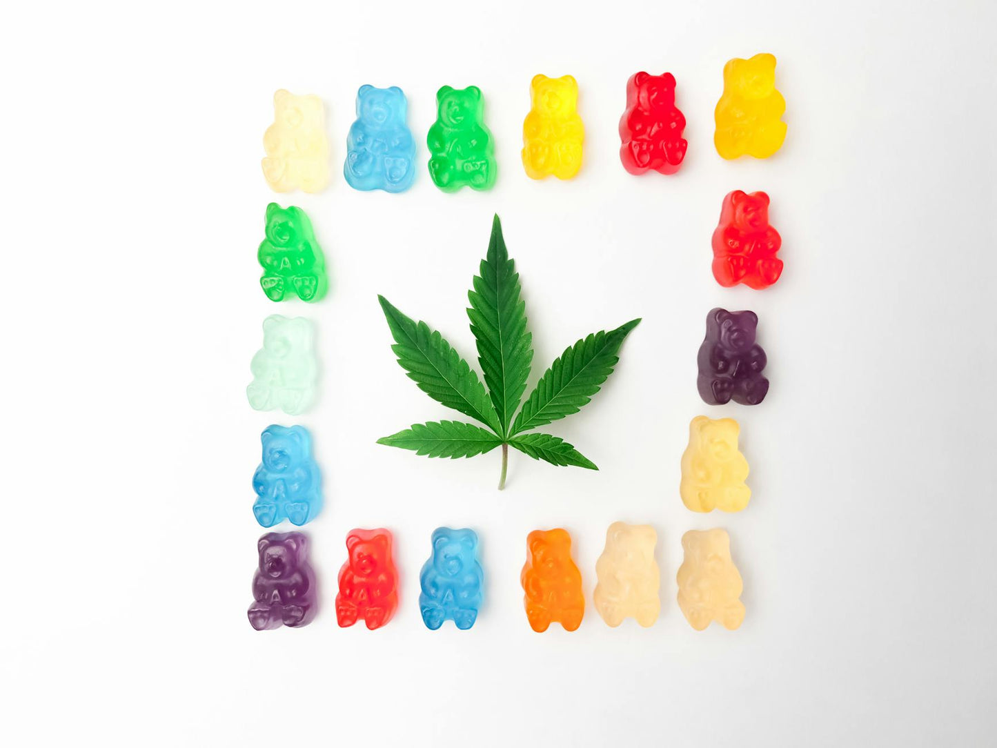 Legal Delta 9 THC gummies made from hemp on a clean surface with hemp leaves and lab documents