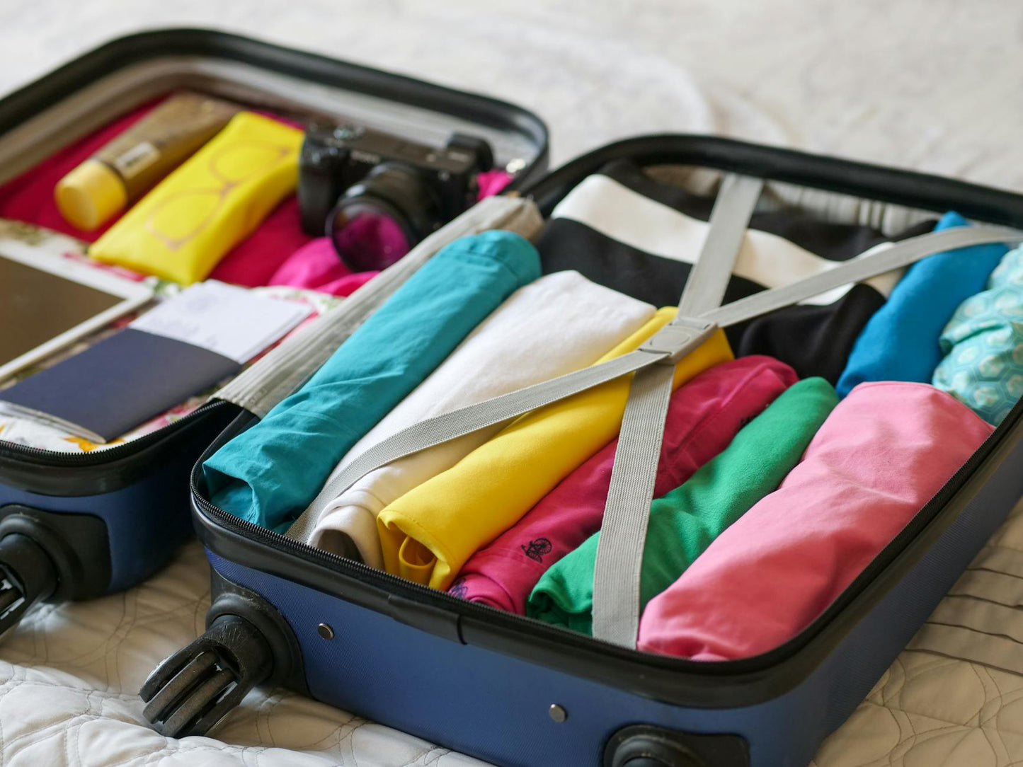 Packed suitcase with gummies and travel documents for hemp product travel planning