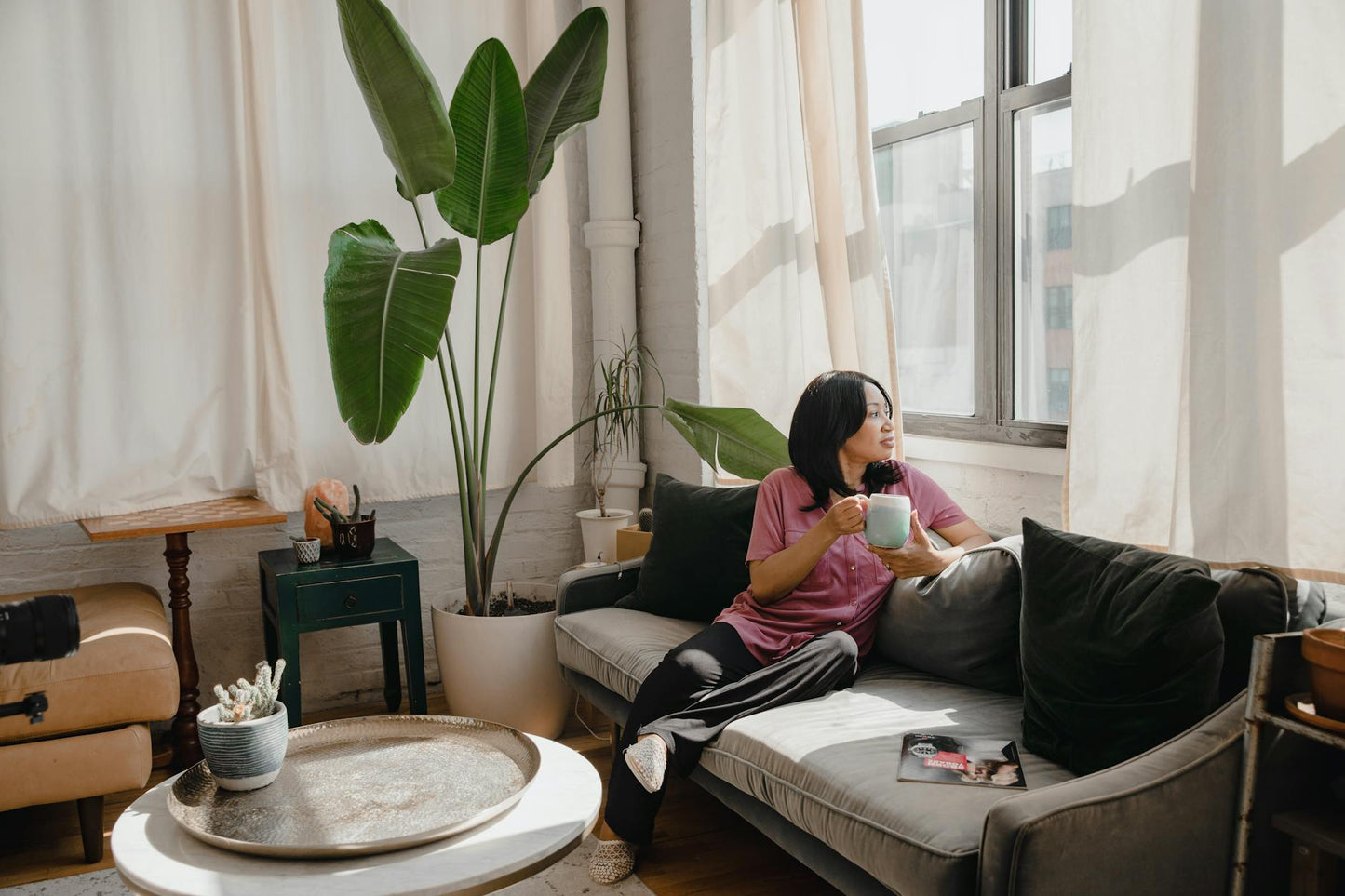 Person in a comfortable living room setting demonstrating a safe, controlled environment for Delta 9 THC dosing