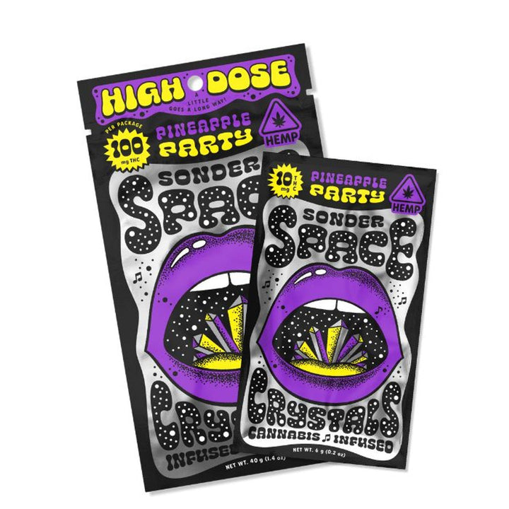 Packaging of Sonder Space THC Crystals in Pineapple Party flavor, featuring colorful and bold design with a purple mouth illustration and cannabis-infused branding.