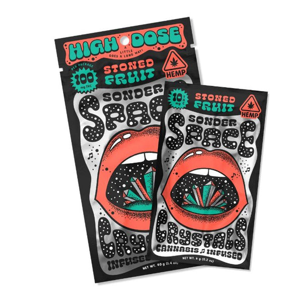 Two packages of Sonder Space THC crystals with cannabis and hemp indications on the packaging