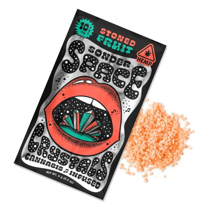 Sonder Space THC Crystals packaging labeled 'Stoned Fruit' with crystals spilled beside the pack, cannabis infused with 10 mg THC.
