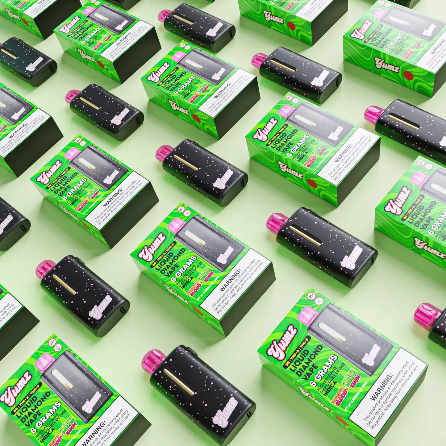 Black yumz liquid diamond vape cartridges with pink caps and gold accents, packaged in vibrant green boxes.