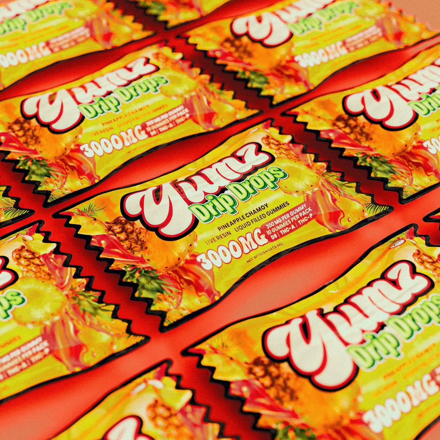 Vibrant yellow and red packaged yumz pineapple chamois drip drops gummies.
